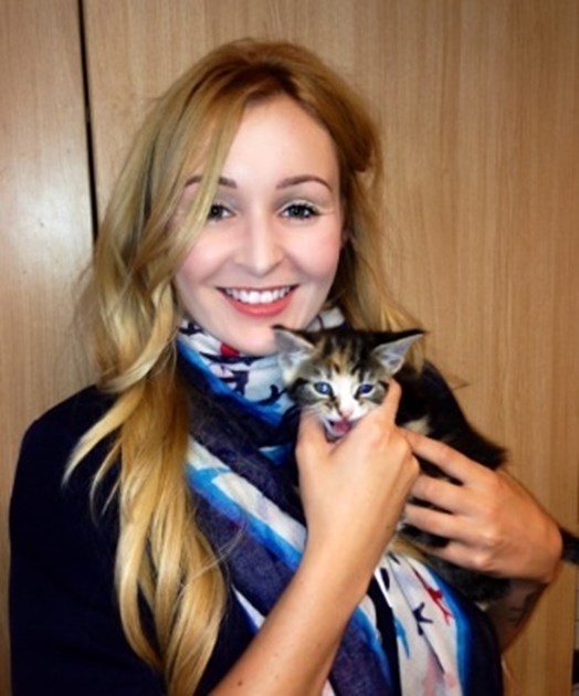 Ann Marie Walsh with a group of participants and kittens during a fundraising session