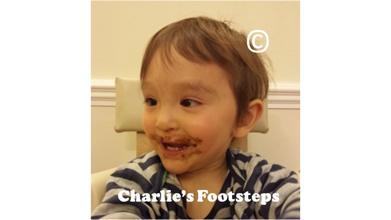 Charlie having his first taste of chocolate